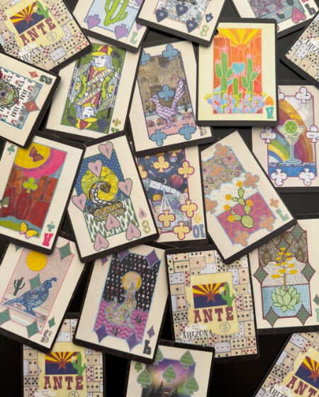 Spread of Arizona ANTE playing cards showing multiple collage faces and patterned backs on a table