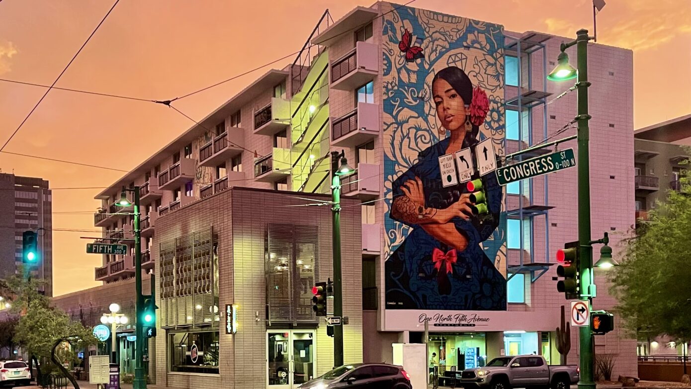 Mural by Ignacio Garcia of an empowered woman, located in Downtown Tucson and featured at the Tucson Art Gallery.