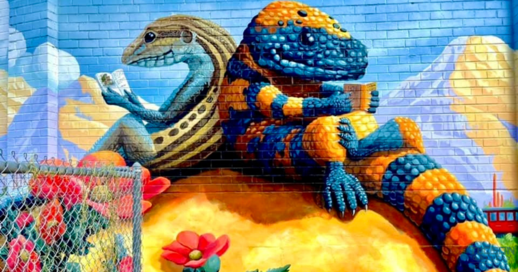 Mural of a Gila monster reading a book by Joe Pagac at Tucson Gallery in AZ.