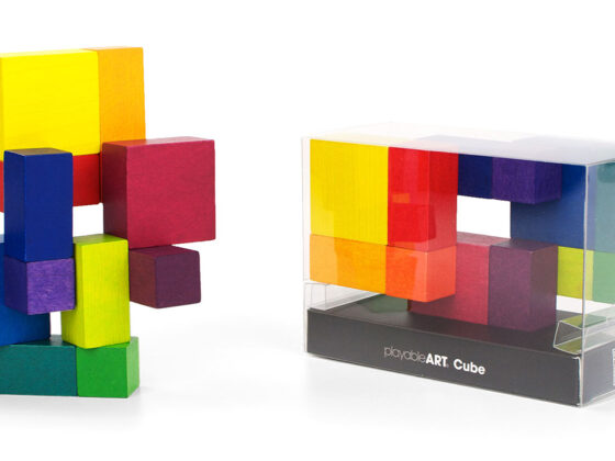 Playable ART Cube packaged in a clear display box with colorful wooden blocks