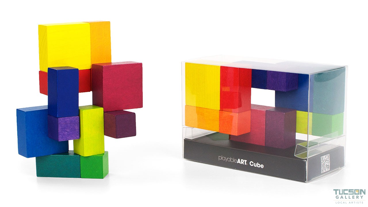 Playable ART Cube packaged in a clear display box with colorful wooden blocks