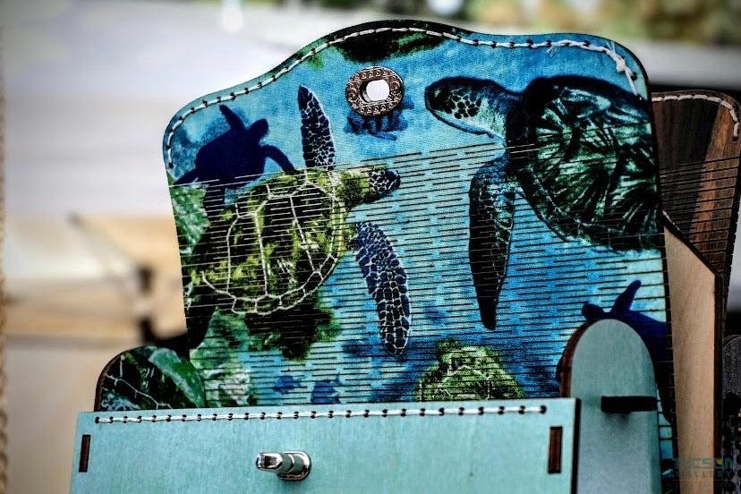 Close-up of TimberTote wooden purse showing living-hinge detail and hardware