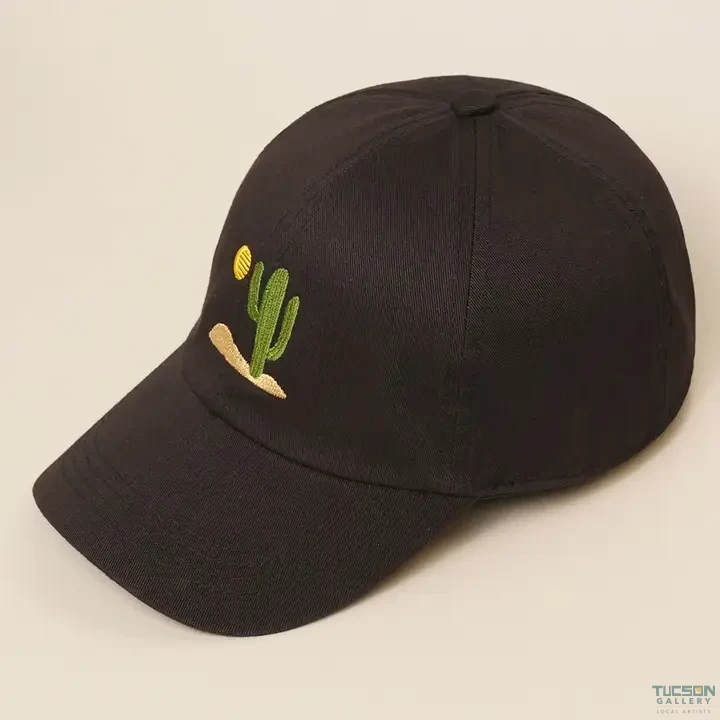 Black cotton dad cap with embroidered cactus and sun, a stylish Tucson souvenir gift from Tucson Gallery.